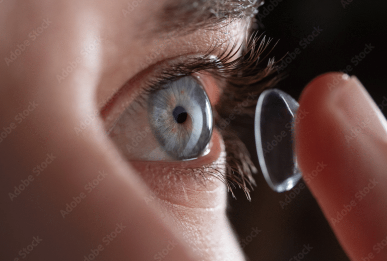 Woman putting in contact lens