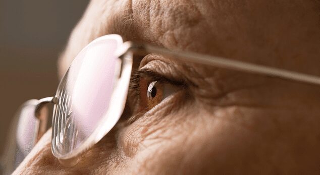 Elderly person wearing glasses