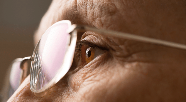 Elderly person wearing glasses