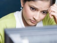 Woman looking at computer screen