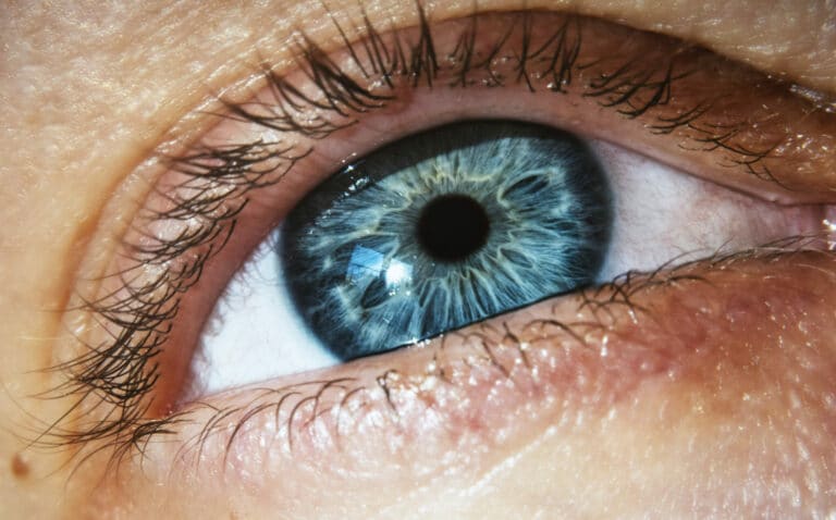 A closeup shot of the eye of a person with the mesmerizing shades of blue