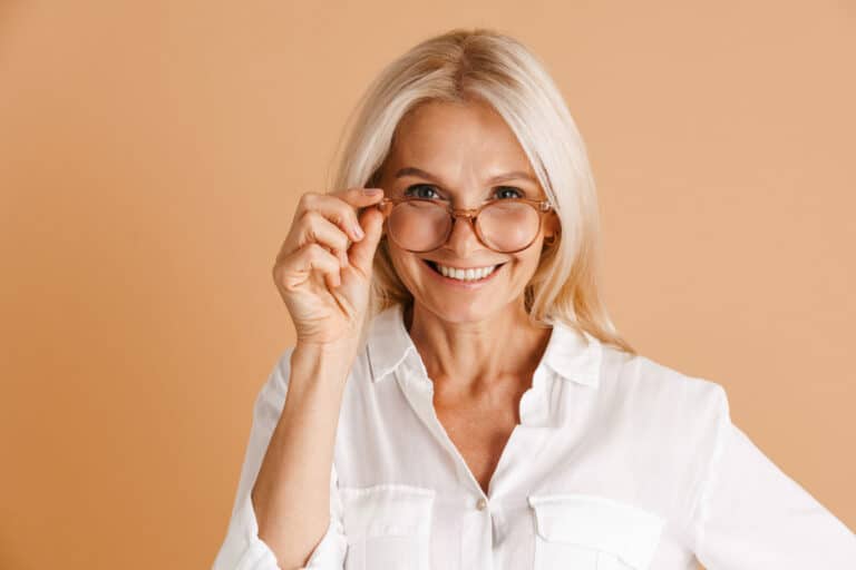 Mature woman in eyeglasses smiling