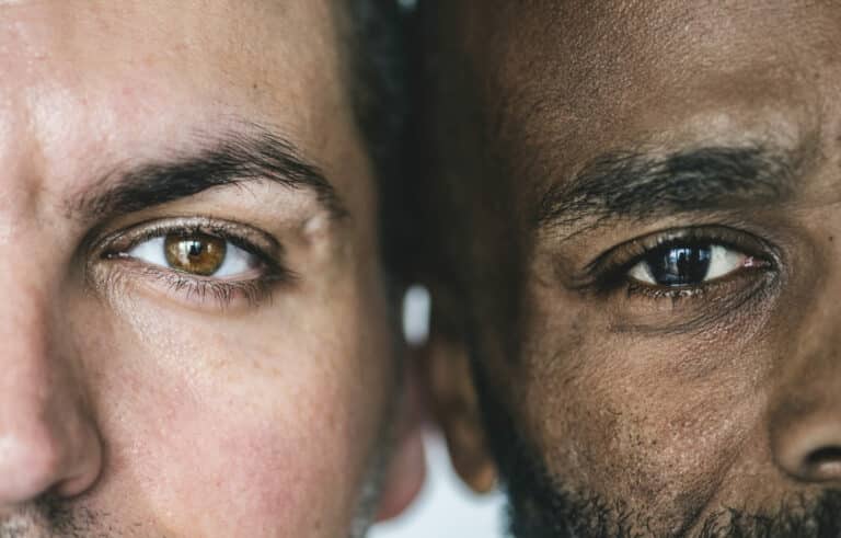 Two different men's eyes closeup