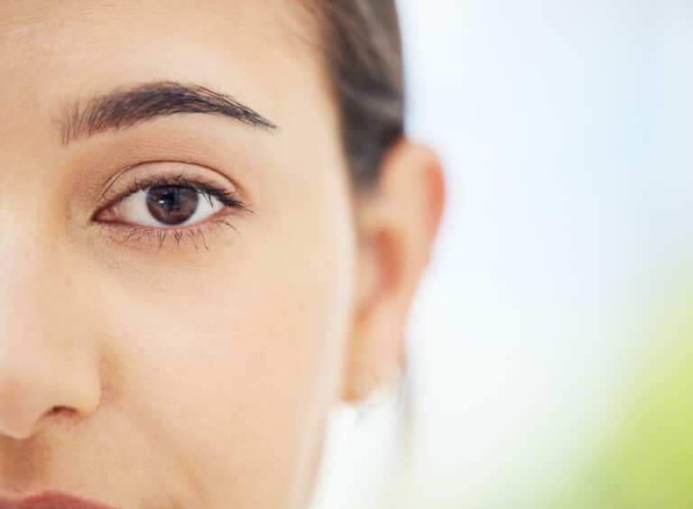 Woman, eye and vision of face in focus for healthy life and sight against a blurred background. Clo.